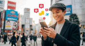 ANAモバイルが20％還元を実施し、スマホ代節約による旅行費用の捻出を提案する日常シーン。